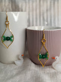 Gold earrings with green beads 