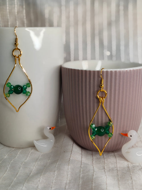 Gold earrings with green beads 